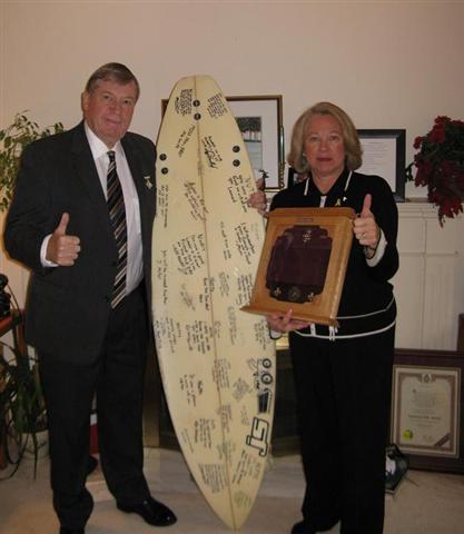 The Nuttalls with the surfboard gift.